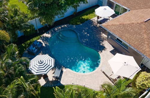 Naples Park House | NEW PINBALL & LOUNGERS! Cute Designer Home, Heated Pool, Close Beach, FREE Bikes