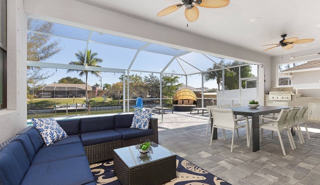Modern 4BD/3BH Waterfront Home with Heated Pool and Golf Access and EV Charger in Cape Coral