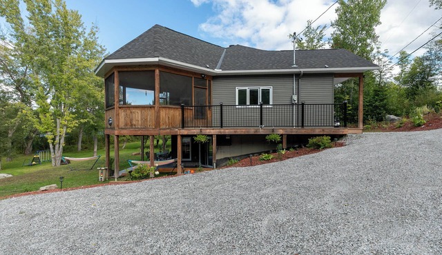 Modern Lakefront Chalet with Games Room, Gym, Wrap Around Balcony & Scenic Views in Bouchette